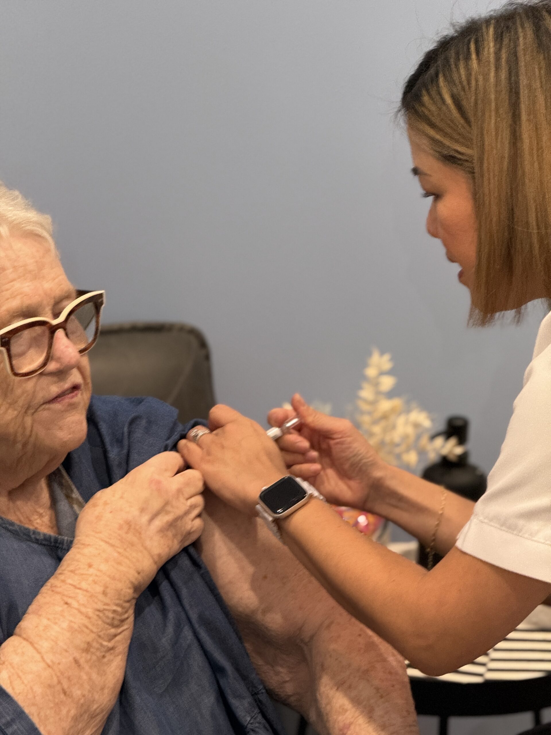 travel vaccines Brisbane — pharmacist administering vaccination at Coorparoo Marketplace Pharmacy